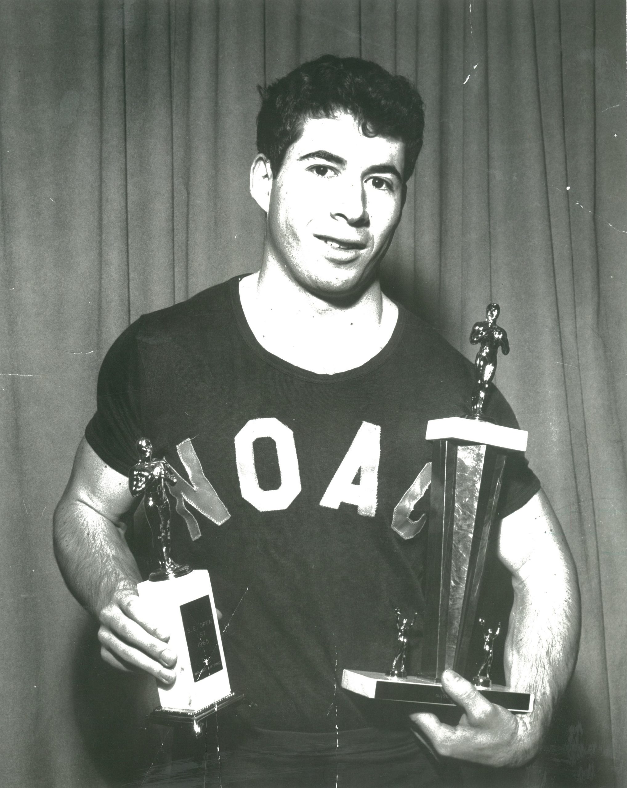 David Berger holds two trophys